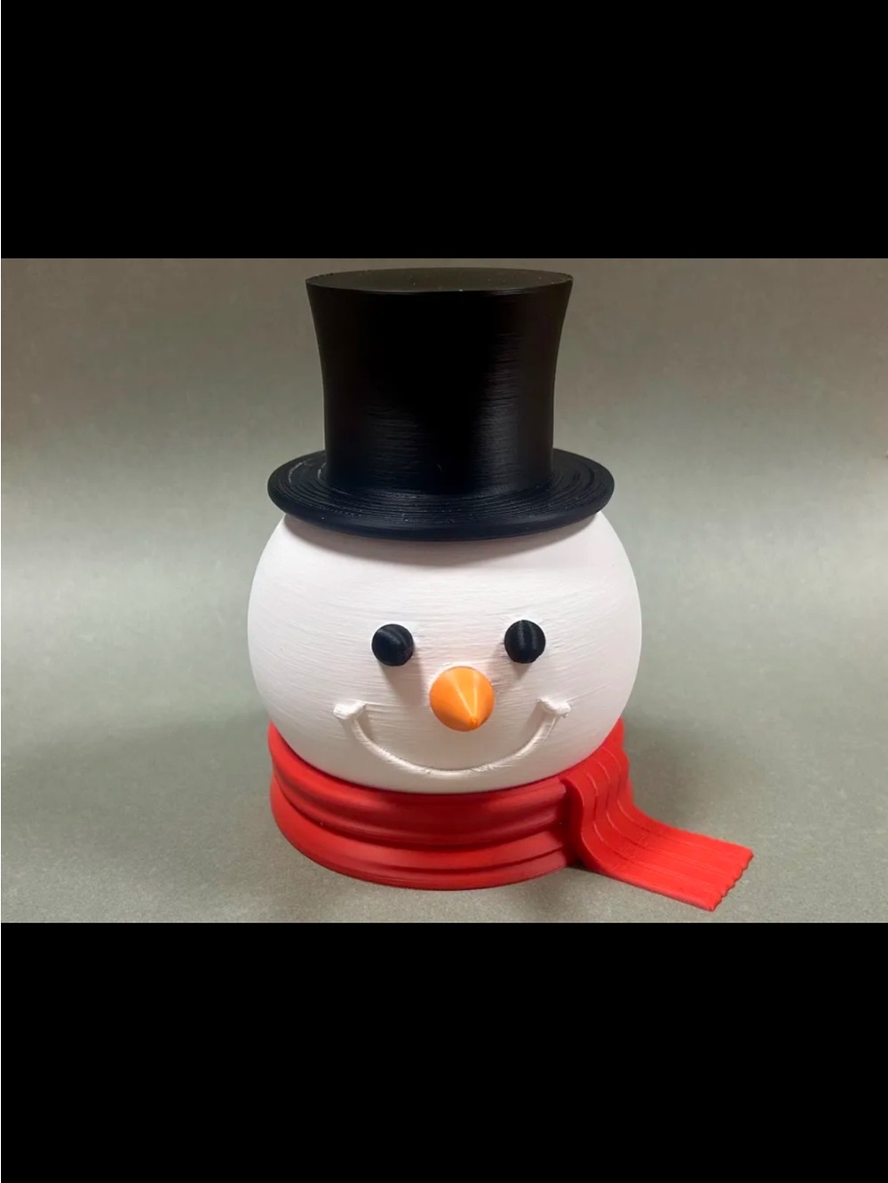 Festive Snowman Head Décor with Black Top Hat and Red Scarf